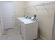 Bright laundry area with full-size washer and dryer, plus overhead storage at 3074 Bay Laurel N Cir, Kissimmee, FL 34744