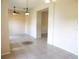 Open-concept space showcasing tile flooring and neutral paint, creating a welcoming atmosphere for comfortable living and gatherings at 3074 Bay Laurel N Cir, Kissimmee, FL 34744