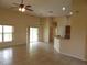 Expansive living area showcasing tile floors, natural light, and an open layout to the kitchen at 3074 Bay Laurel N Cir, Kissimmee, FL 34744