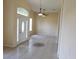 Bright living room featuring tile floors, a stylish decorative inlay, and high ceilings with abundant natural light at 3074 Bay Laurel N Cir, Kissimmee, FL 34744