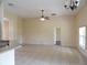 Open living room features tile floors and a ceiling fan at 3074 Bay Laurel N Cir, Kissimmee, FL 34744
