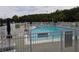 Fenced community pool area with ample seating for residents at 3074 Bay Laurel N Cir, Kissimmee, FL 34744