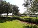 Street view of neighborhood with landscaped lawns at 3074 Bay Laurel N Cir, Kissimmee, FL 34744