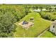 The community park features a playground, a gazebo, and a pond surrounded by trees at 3274 Hunters Chase Loop, Kissimmee, FL 34743