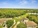 Aerial photo of a community park with playground, a gazebo, and mature trees at 3274 Hunters Chase Loop, Kissimmee, FL 34743