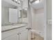 Bathroom featuring granite counters, white cabinets and a standup shower at 3274 Hunters Chase Loop, Kissimmee, FL 34743