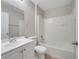 Bathroom featuring a tub-shower combo, toilet, and vanity at 3274 Hunters Chase Loop, Kissimmee, FL 34743
