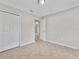 Clean bedroom featuring a closet, neutral paint, and tile flooring at 3274 Hunters Chase Loop, Kissimmee, FL 34743