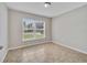 Bedroom with neutral paint, tile floors, and a window with blinds at 3274 Hunters Chase Loop, Kissimmee, FL 34743
