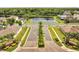 The Quail Ridge community is marked by manicured palm trees and sign at 3274 Hunters Chase Loop, Kissimmee, FL 34743