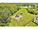 A view of the community playground, gazebo, and pond, all nestled within lush greenery at 3274 Hunters Chase Loop, Kissimmee, FL 34743