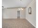 Open-concept dining room with tile flooring, arched doorway detail, and modern chandelier at 3274 Hunters Chase Loop, Kissimmee, FL 34743