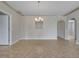 Dining room featuring archway details, tile floors, and a contemporary chandelier at 3274 Hunters Chase Loop, Kissimmee, FL 34743