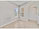 Eat-in kitchen featuring neutral wall paint, ceramic tile flooring, and archway to the kitchen at 3274 Hunters Chase Loop, Kissimmee, FL 34743