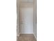 A classic six panel front door stands within the entryway featuring neutral wall paint and ceramic tile flooring at 3274 Hunters Chase Loop, Kissimmee, FL 34743