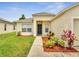 Charming home featuring lush landscaping, mulch beds and a well-manicured lawn at 3274 Hunters Chase Loop, Kissimmee, FL 34743