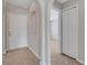 Hallway with an arched doorway, decorative niche, and neutral color scheme at 3274 Hunters Chase Loop, Kissimmee, FL 34743