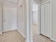 Inviting foyer featuring tile flooring, decorative niche, and access to various rooms at 3274 Hunters Chase Loop, Kissimmee, FL 34743