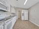 Bright kitchen featuring white cabinets, tile floors, and stainless steel appliances at 3274 Hunters Chase Loop, Kissimmee, FL 34743