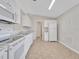 Bright, modern kitchen featuring tile floors, white cabinets, and ample counter space at 3274 Hunters Chase Loop, Kissimmee, FL 34743