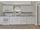 Clean, bright kitchen with white cabinets, modern appliances, and ample counter space at 3274 Hunters Chase Loop, Kissimmee, FL 34743