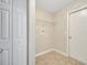 Small laundry room with washer/dryer hookups and built-in shelving at 3274 Hunters Chase Loop, Kissimmee, FL 34743
