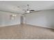 Open concept living room featuring tile flooring, ceiling fans, and an archway at 3274 Hunters Chase Loop, Kissimmee, FL 34743