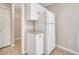 Functional pantry area featuring white cabinets and an adjacent closet for storage at 3274 Hunters Chase Loop, Kissimmee, FL 34743