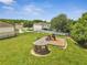 The aerial view features a playground, a gazebo, and trees in the neighborhood at 3274 Hunters Chase Loop, Kissimmee, FL 34743