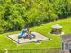 A community playground has a blue slide and a gazebo at 3274 Hunters Chase Loop, Kissimmee, FL 34743