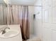 Well-lit bathroom with a shower and a vanity with a sink at 3428 Village Green Ct, St Cloud, FL 34772