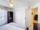 Bedroom with a window, closet, bookshelf, and view of the dining area at 3428 Village Green Ct, St Cloud, FL 34772