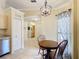 An inviting dining area with tile flooring and a view of the living spaces at 3428 Village Green Ct, St Cloud, FL 34772