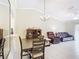 A spacious living room features tile flooring and plenty of natural light at 3428 Village Green Ct, St Cloud, FL 34772