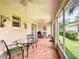 Comfortable screened patio features stylish furniture and ceiling fans for outdoor enjoyment at 3428 Village Green Ct, St Cloud, FL 34772