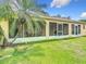 Inviting screened patio adjacent to lush landscaping provides a relaxing outdoor retreat at 3428 Village Green Ct, St Cloud, FL 34772