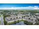 Aerial shot showcasing lush landscaping, lake, and community at 3603 Sanctuary Dr, St Cloud, FL 34769