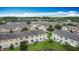 Overhead view of community featuring well-maintained lawns and townhouses at 3603 Sanctuary Dr, St Cloud, FL 34769
