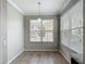 Bright dining area features neutral paint, tile floors, and a modern light fixture at 3603 Sanctuary Dr, St Cloud, FL 34769