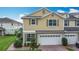 Charming townhouse boasts a two-car garage and well-maintained landscaping at 3603 Sanctuary Dr, St Cloud, FL 34769