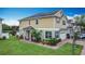 A spacious two-story home features a well-manicured lawn and inviting curb appeal at 3603 Sanctuary Dr, St Cloud, FL 34769