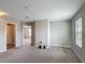 Living room featuring neutral walls, carpeted floors and an entrance to other bedrooms at 3603 Sanctuary Dr, St Cloud, FL 34769