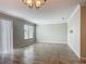 Spacious living room features neutral paint and tile flooring, filled with natural light at 3603 Sanctuary Dr, St Cloud, FL 34769