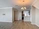 Open-concept living area features neutral paint, crown molding, and tile floors at 3603 Sanctuary Dr, St Cloud, FL 34769
