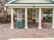 Pool house with brick columns and posted rules, enhancing the community's amenities at 3603 Sanctuary Dr, St Cloud, FL 34769
