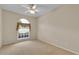 Carpeted bedroom with window and neutral paint at 4065 Kingsley St, Clermont, FL 34711