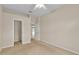 Carpeted bedroom with closet and white doors leading to other rooms at 4065 Kingsley St, Clermont, FL 34711