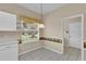 Kitchen nook area featuring a large window and tile flooring at 4065 Kingsley St, Clermont, FL 34711