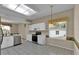 Bright kitchen with stainless steel appliances, tile floors, and a large window at 4065 Kingsley St, Clermont, FL 34711