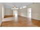 Large living room features neutral walls, tile floors, and an open layout to the kitchen and the sun room at 4065 Kingsley St, Clermont, FL 34711